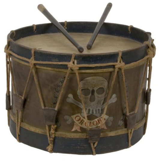 Colorful, metal-bodied Queen's Lancer drum, complete with drumsticks, 11 inches by 16 inches. Image courtesy of Fontaine’s Auction Gallery.